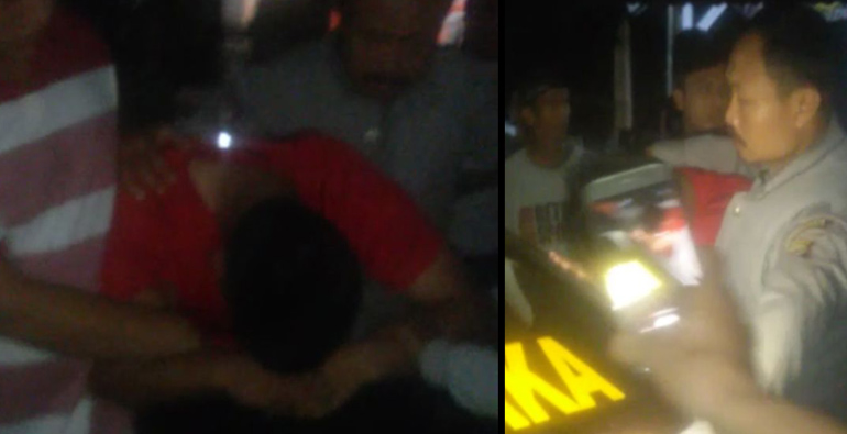 ASN (baju merah) saat dibawa oleh Polisi usai digerebek warga Lingkar Timur